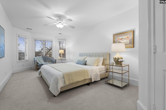 bedroom featuring carpet flooring, visible vents, baseboards, and ceiling fan