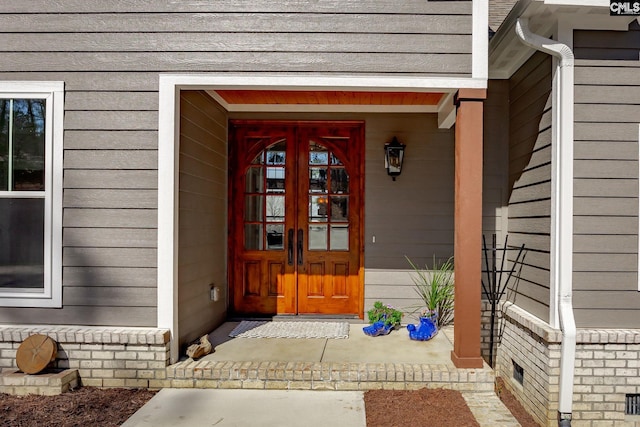 entrance to property featuring french doors