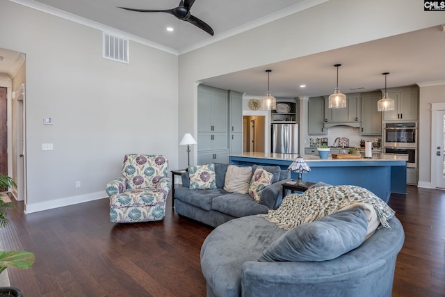 living area featuring visible vents, baseboards, dark wood finished floors, and crown molding