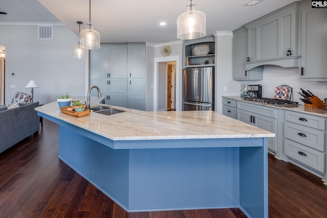 kitchen featuring visible vents, appliances with stainless steel finishes, light stone countertops, open shelves, and a sink