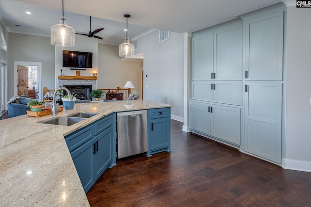 kitchen featuring open floor plan, dark wood-type flooring, stainless steel dishwasher, a fireplace, and a sink