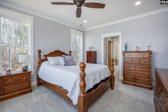 bedroom with light colored carpet, multiple windows, crown molding, and visible vents