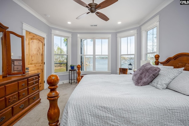 carpeted bedroom featuring ornamental molding, recessed lighting, and visible vents