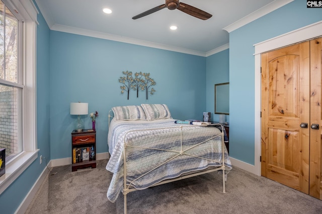 carpeted bedroom with a ceiling fan, recessed lighting, crown molding, and baseboards