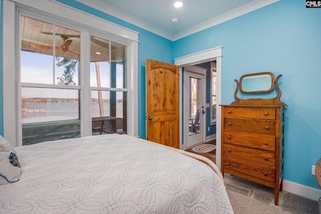 carpeted bedroom with baseboards and crown molding