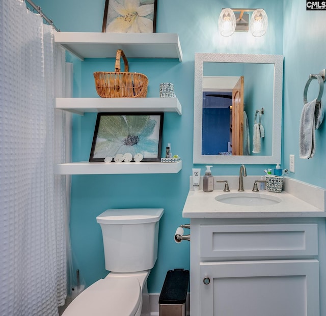 full bathroom with toilet, a shower with shower curtain, and vanity