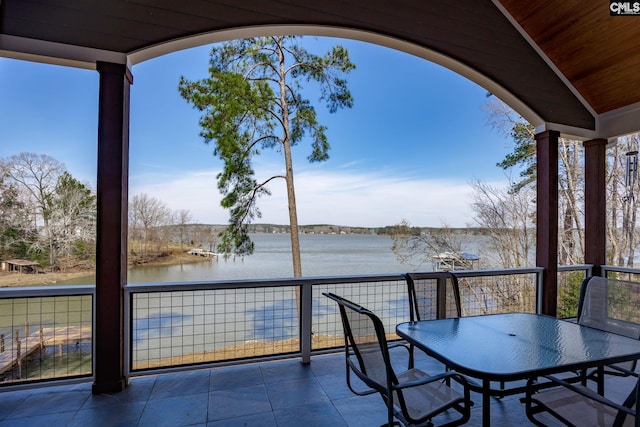 view of patio / terrace with outdoor dining area and a water view