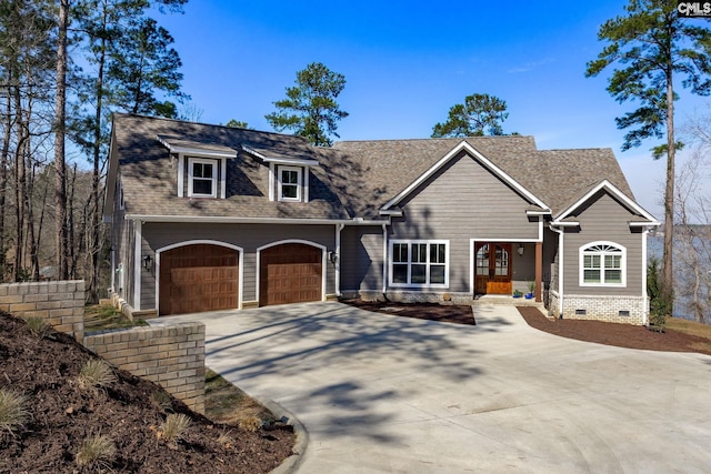 view of front of property featuring concrete driveway, crawl space, an attached garage, and roof with shingles