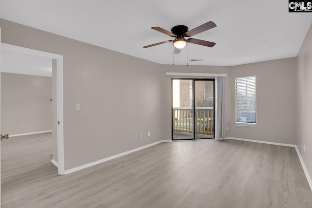 unfurnished room featuring light wood-style floors, baseboards, and a ceiling fan