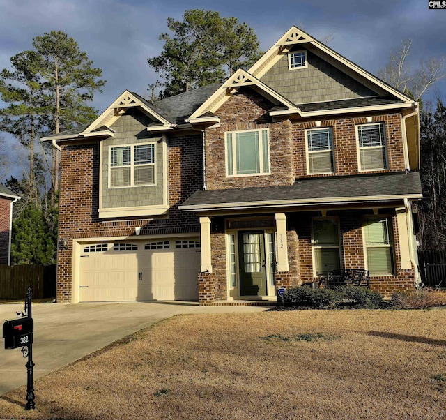 craftsman house featuring driveway, a garage, fence, a porch, and brick siding