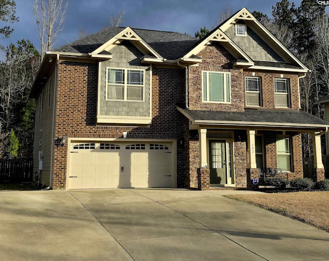 craftsman-style house with concrete driveway, brick siding, a porch, and an attached garage