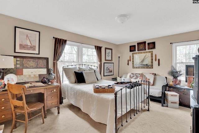 bedroom featuring light carpet