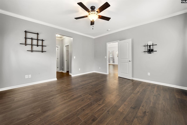 unfurnished room featuring dark wood-type flooring, ornamental molding, baseboards, and a ceiling fan