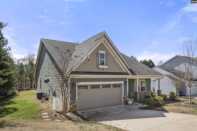 view of front of property featuring driveway, roof with shingles, stone siding, and central air condition unit