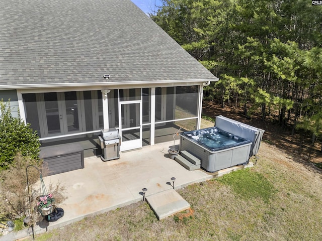 view of patio with a sunroom, a hot tub, and grilling area