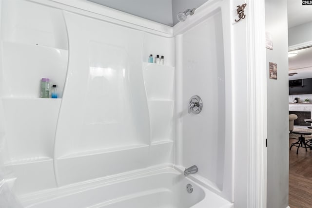 full bathroom featuring shower / tub combination and wood finished floors