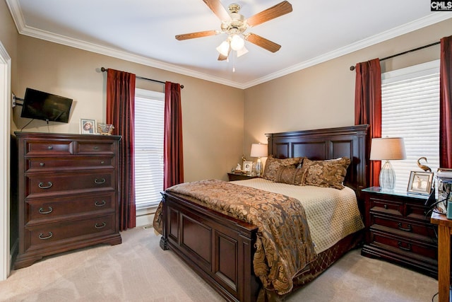 bedroom with ornamental molding, light colored carpet, and ceiling fan