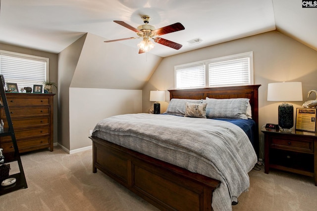 bedroom featuring baseboards, visible vents, a ceiling fan, light colored carpet, and lofted ceiling