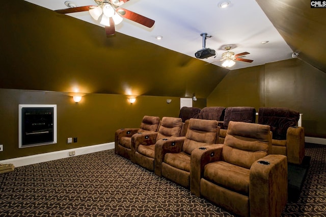 cinema with carpet floors, baseboards, a ceiling fan, and lofted ceiling