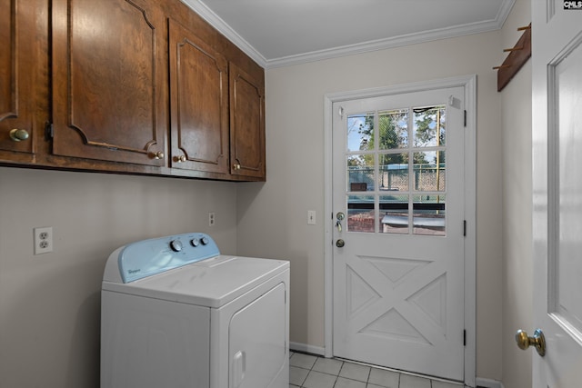 washroom with washer / clothes dryer, light tile patterned flooring, cabinet space, and crown molding