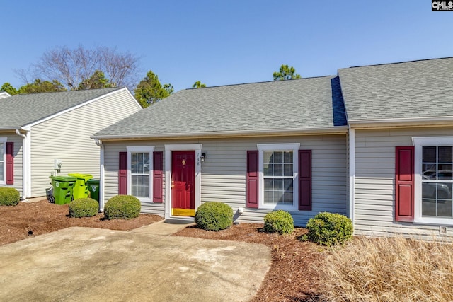 view of front of house with a shingled roof