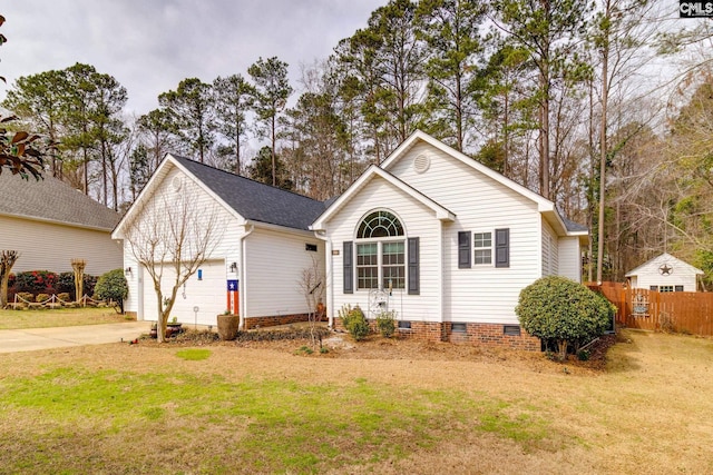 ranch-style house with a garage, concrete driveway, crawl space, fence, and a front lawn