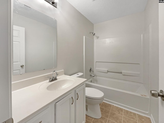 bathroom featuring bathing tub / shower combination, toilet, vanity, a textured ceiling, and tile patterned flooring