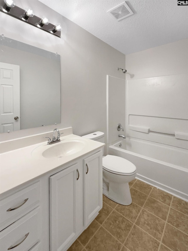 full bath featuring a textured ceiling, toilet, vanity, visible vents, and tub / shower combination