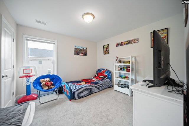 carpeted bedroom with visible vents