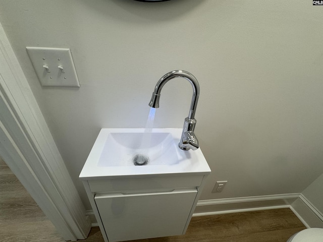 interior details featuring baseboards and vanity