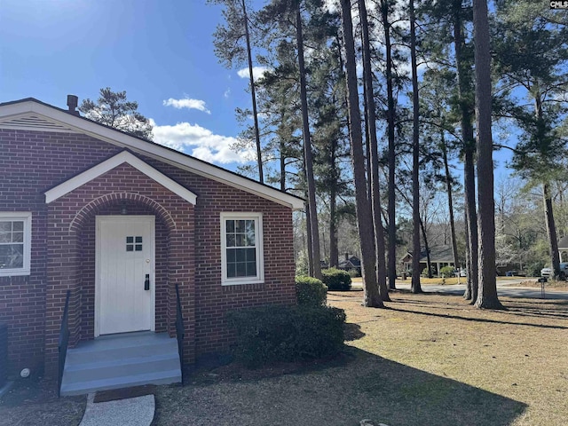 exterior space with brick siding