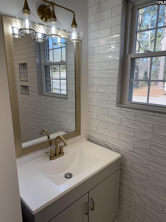 bathroom with tile walls and vanity