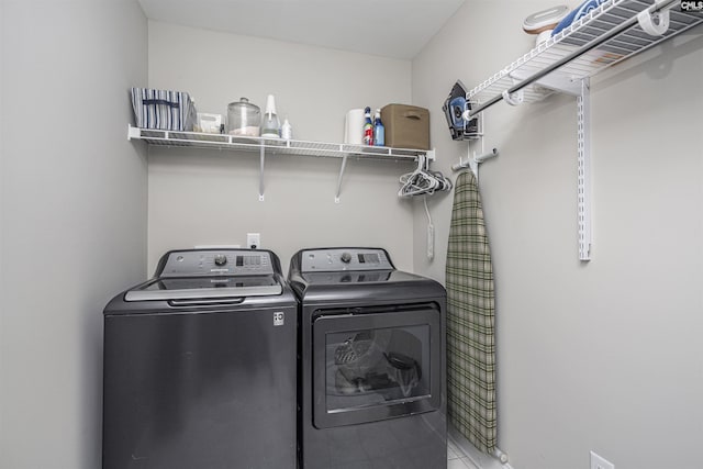 clothes washing area featuring laundry area and independent washer and dryer