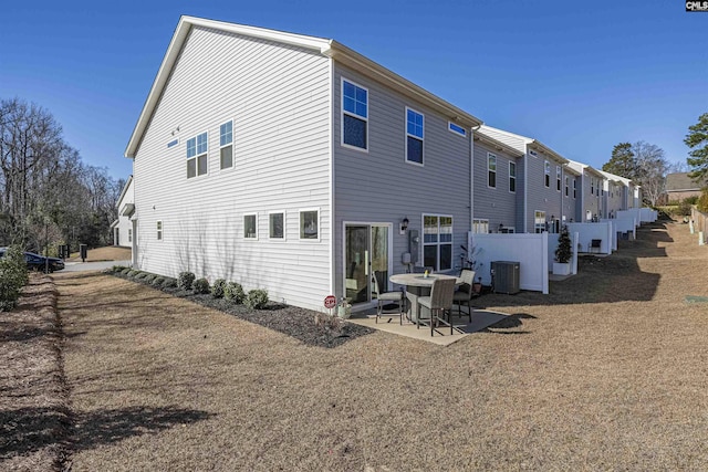 back of house with fence, cooling unit, and a patio