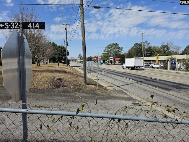 view of street with sidewalks and traffic signs