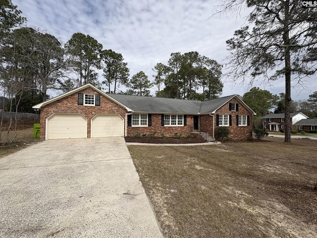 ranch-style house featuring crawl space, driveway, an attached garage, and brick siding