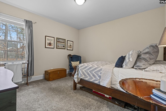 bedroom featuring baseboards and carpet flooring