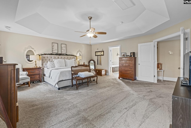 bedroom with baseboards, visible vents, a raised ceiling, and carpet flooring