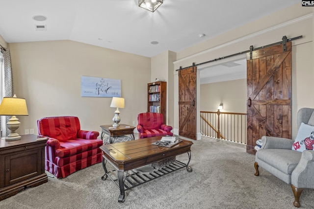 carpeted living room featuring lofted ceiling and a barn door