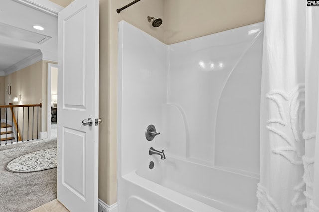 bathroom with crown molding, shower / bath combination with curtain, and tile patterned floors