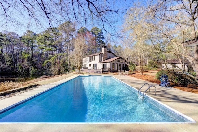 outdoor pool featuring a patio area