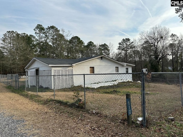 view of home's exterior featuring fence