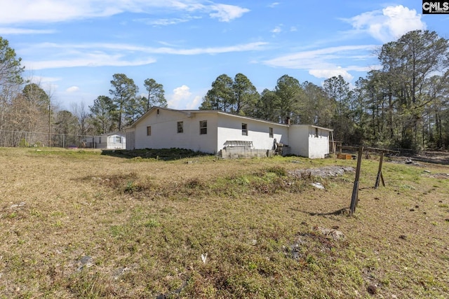 view of side of property with fence