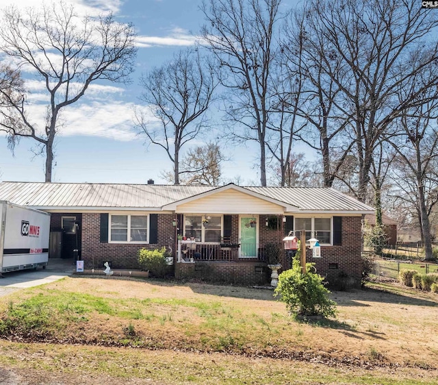 ranch-style house with a porch, crawl space, a front lawn, and brick siding