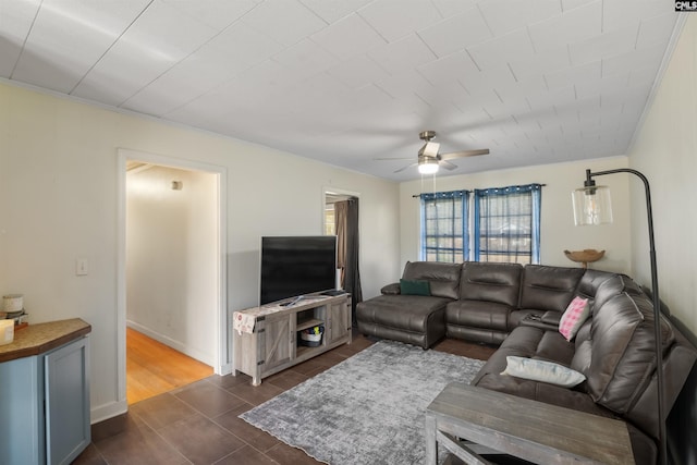 living area with a ceiling fan