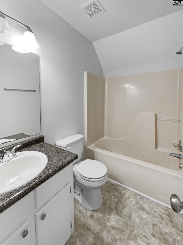 bathroom with visible vents, toilet, shower / tub combination, vaulted ceiling, and vanity