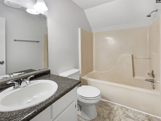 full bath featuring  shower combination, toilet, vaulted ceiling, and vanity