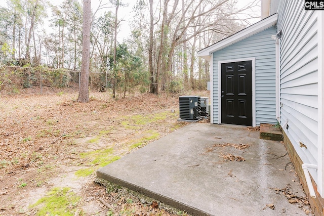 view of yard featuring fence and cooling unit