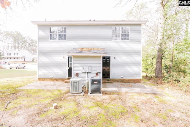 rear view of property featuring a patio and central AC unit