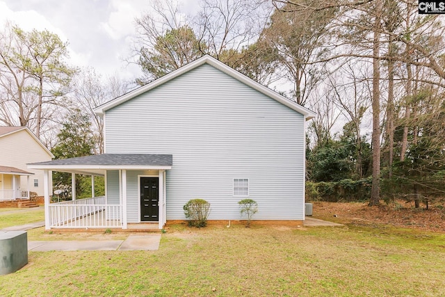 exterior space featuring a porch and a lawn